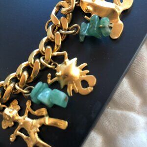 Museum Quality Turquoise and gold charm bracelet